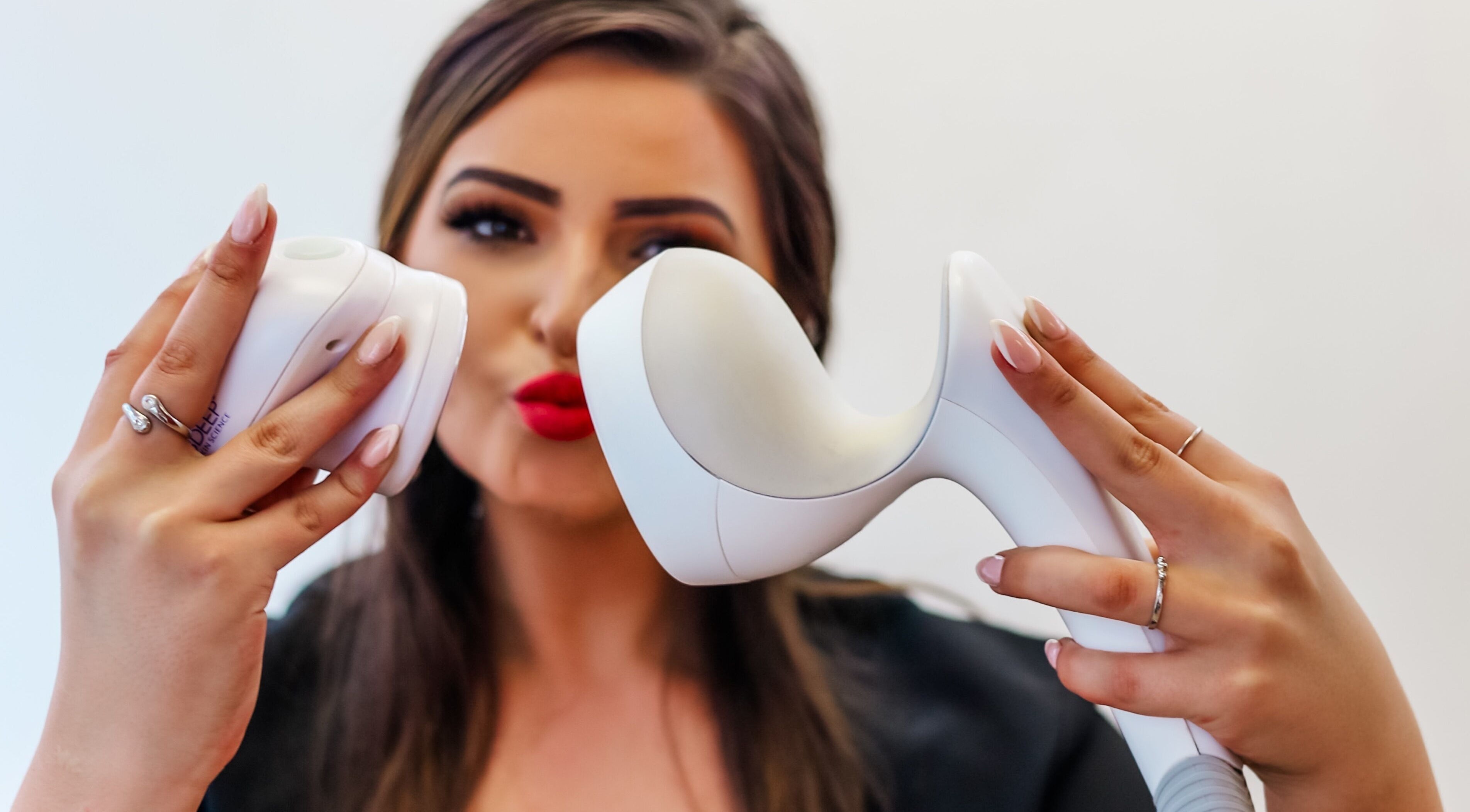 Professional showcasing beauty device at Young Again Aesthetics, Sandton, Gauteng, ZA.