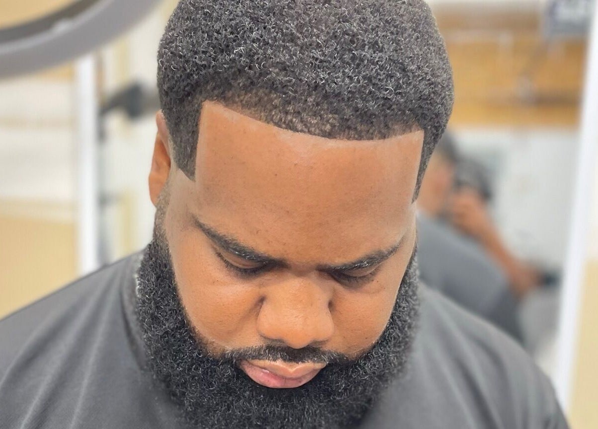 Close-up of a client's fresh haircut at Sid the Barber in Oshawa, Ontario, CA, showcasing sharp lines and beard styling.