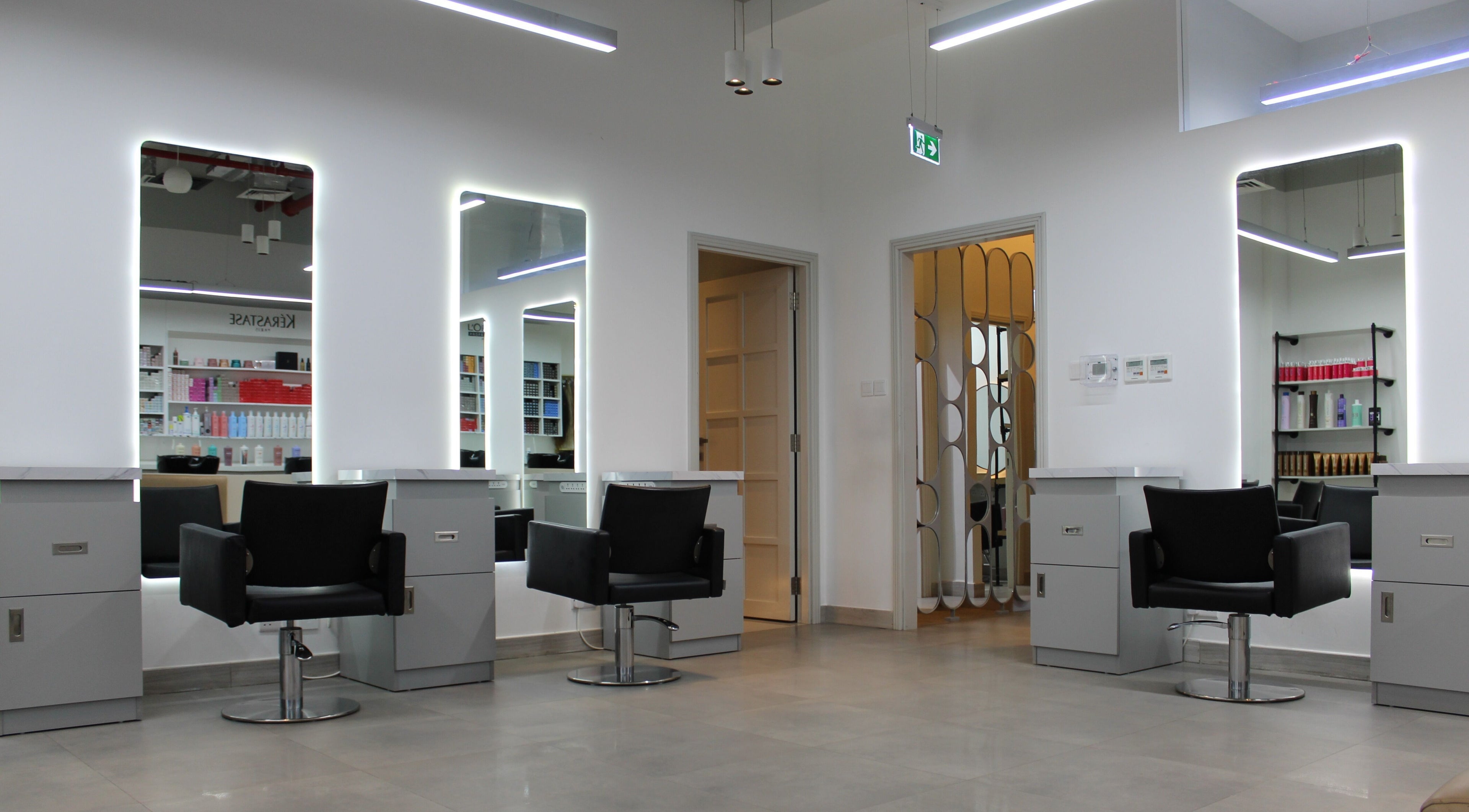 Chic and modern styling chairs at Elata Beauty Salon in Dubai, AE showcasing a sleek, elegant salon interior.