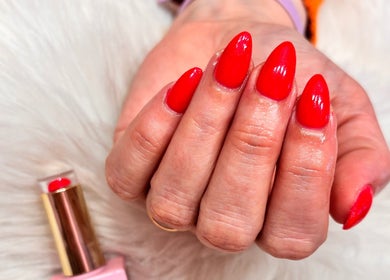 Stylish red nails at Cherry Blossom Beauty in Thornaby, England.