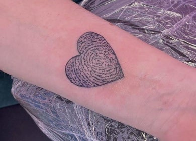 Heart-shaped fingerprint tattoo at Cherry Blossom Beauty, Thornaby, England, GB.