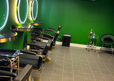 Elegant hair styling area at Halo Hair Salon, Malton, England, GB, with modern décor and sleek chairs.