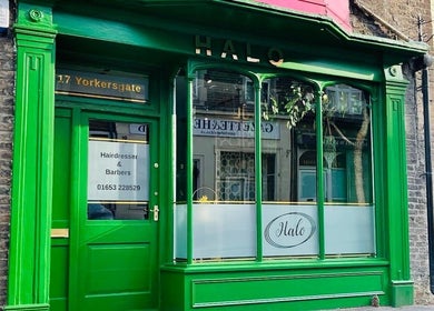 Halo Hair Salon's vibrant green exterior in Malton, England, GB offers inviting hair and beauty services.