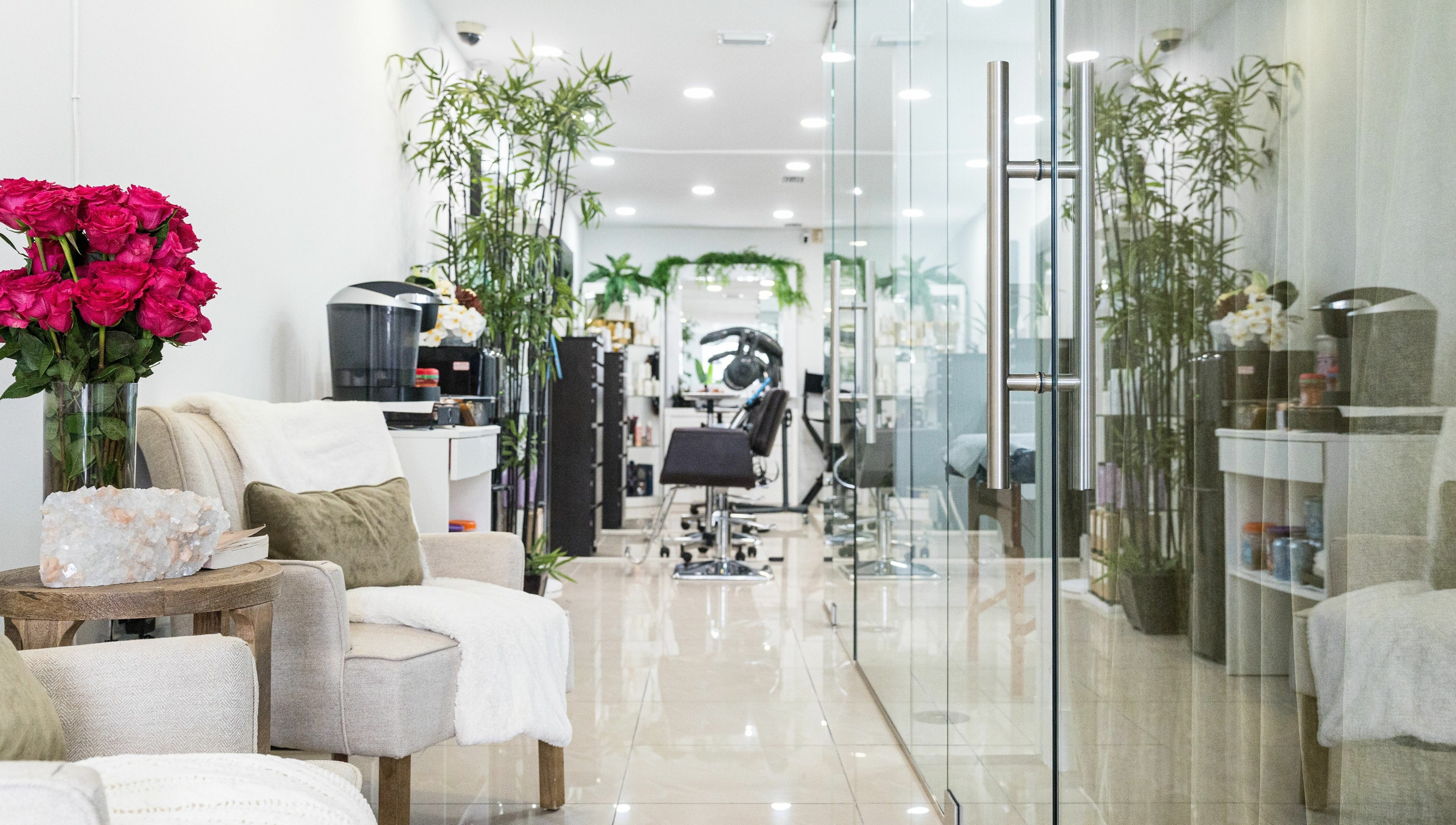 Relaxing seating area at BG Integrative Studio, Coral Gables, Florida, US with plush chairs and vibrant decor.