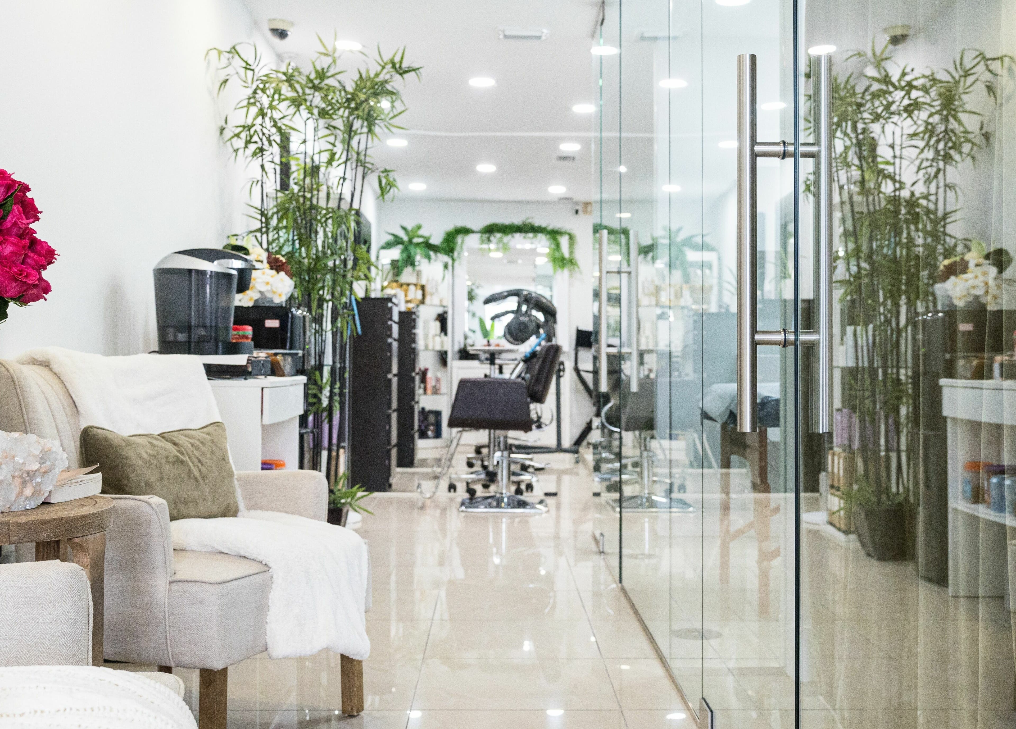 Relaxing seating area at BG Integrative Studio, Coral Gables, Florida, US with plush chairs and vibrant decor.