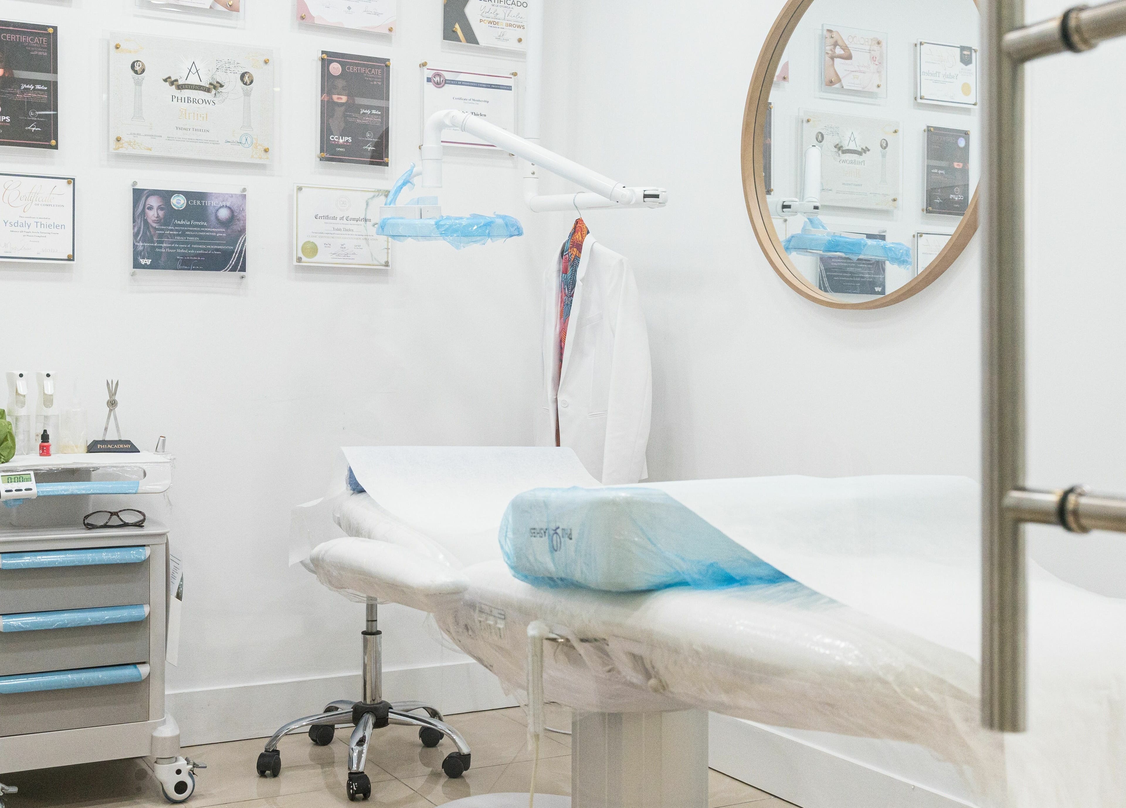 Modern treatment room at BG Integrative Studio, Coral Gables, Florida, US with certificates on display.