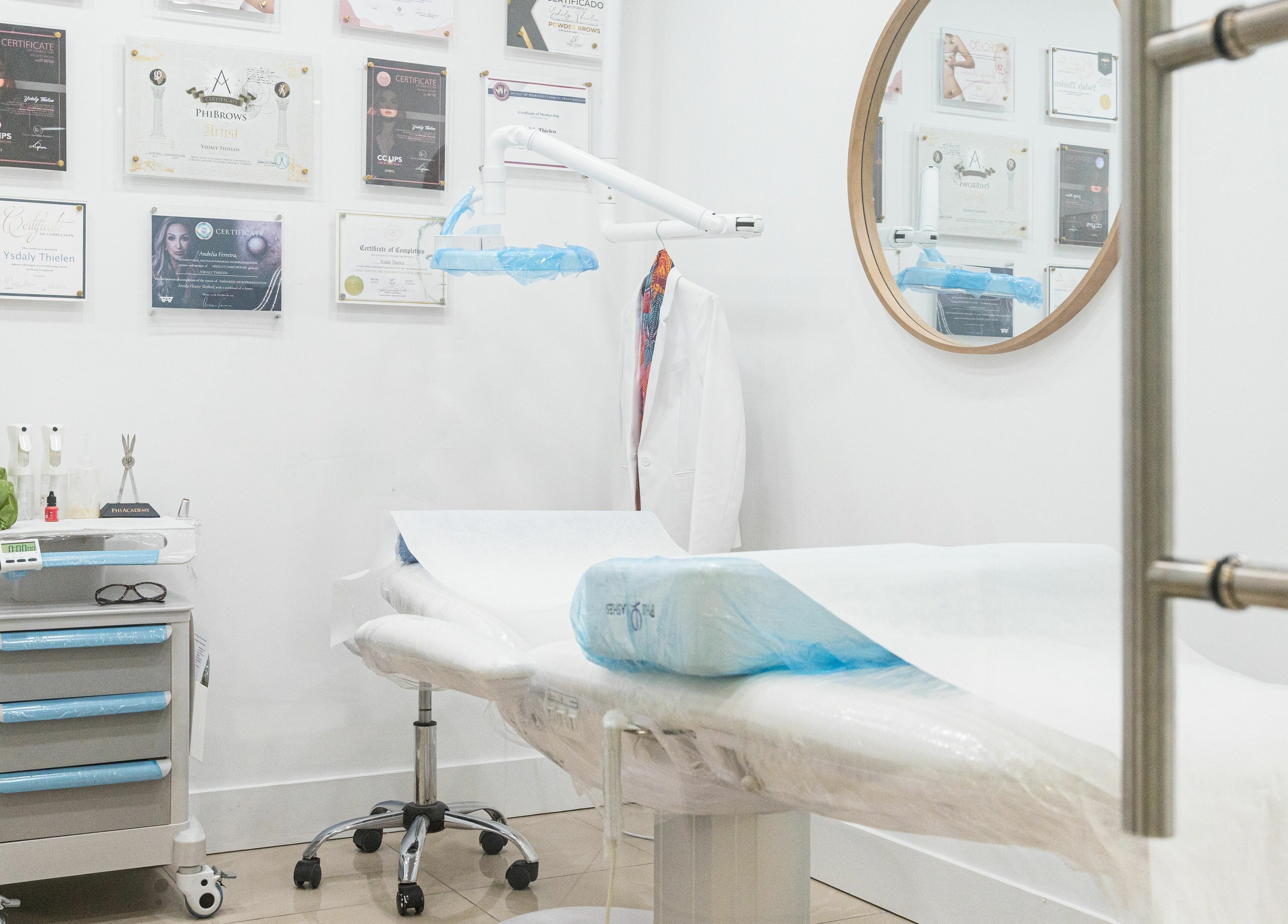 Modern treatment room at BG Integrative Studio, Coral Gables, Florida, US with certificates on display.