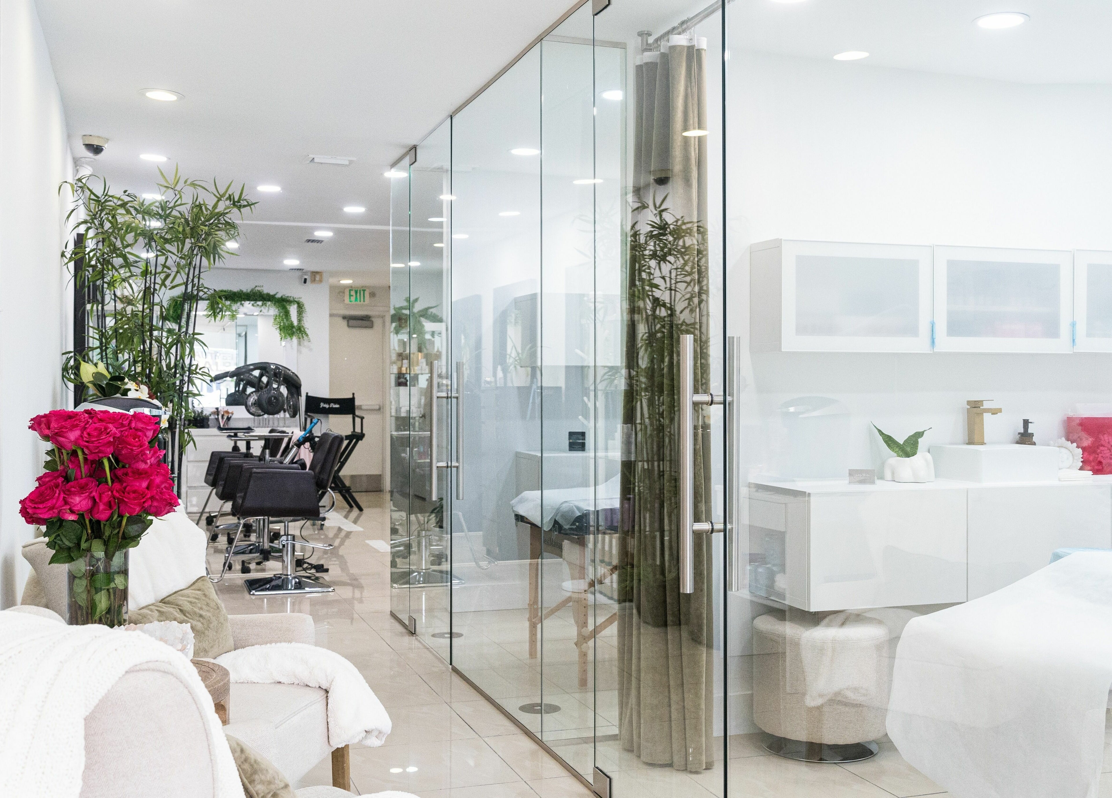 Bright interior of BG Integrative Studio in Coral Gables, Florida, US featuring modern salon chairs and decor.