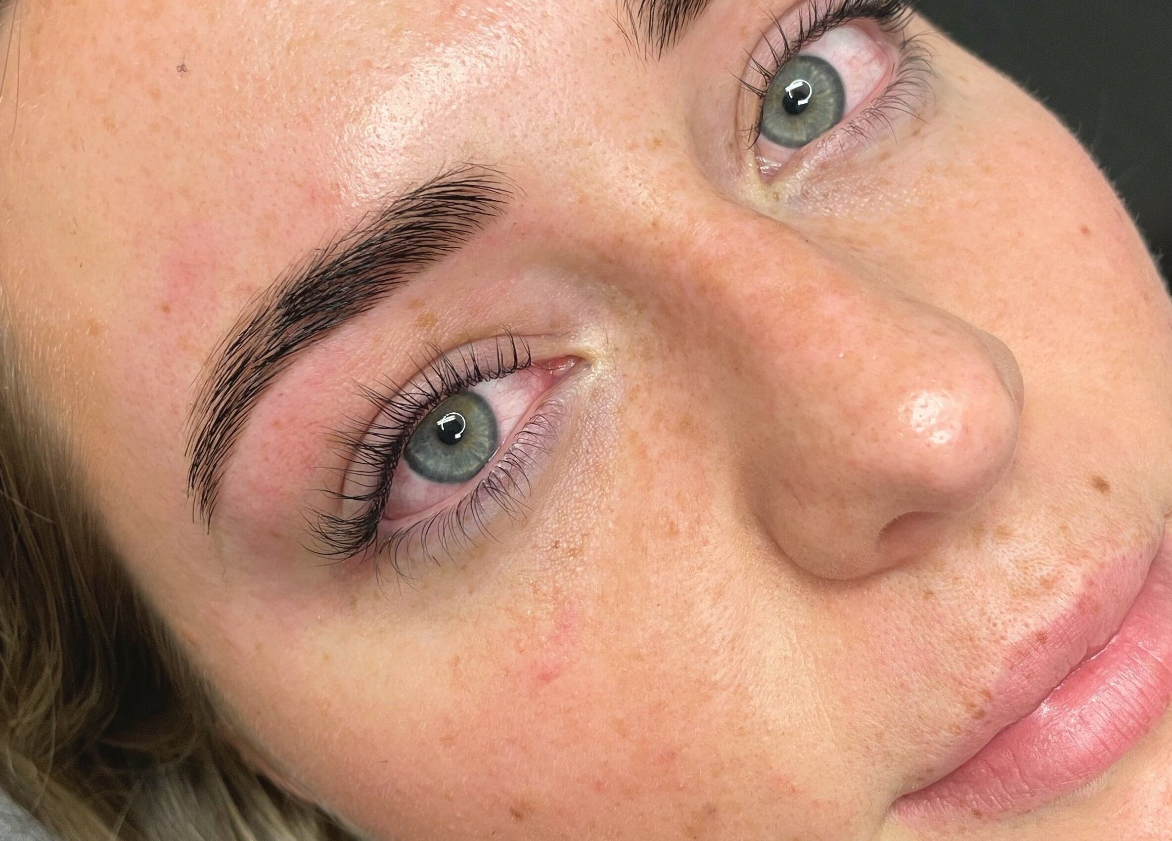 Close-up of expertly groomed brows and lashes at Haus of Arches, Bicton, Western Australia, AU.