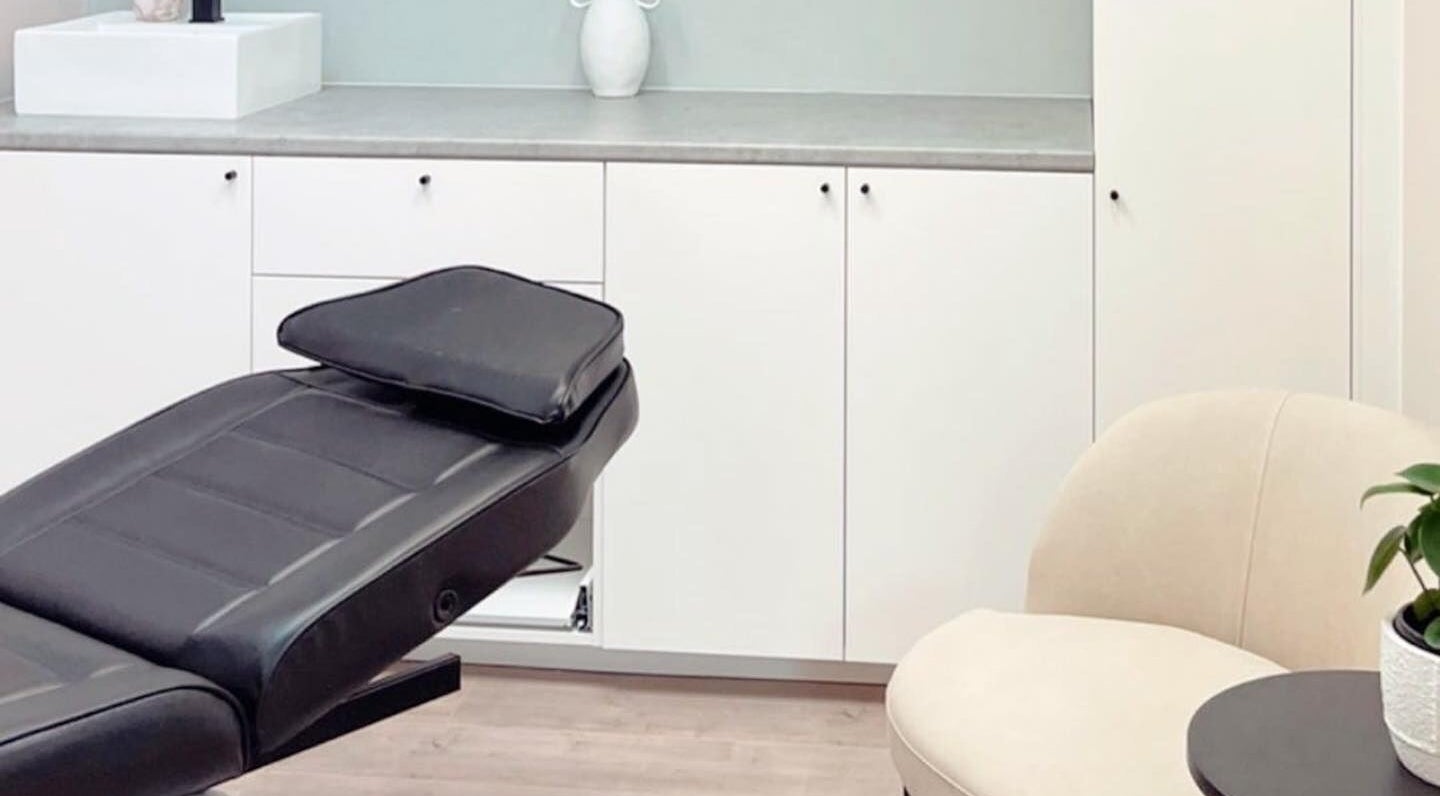 Elegant treatment room at Haus of Arches, Bicton, Western Australia, AU with sleek chair and cozy ambiance.