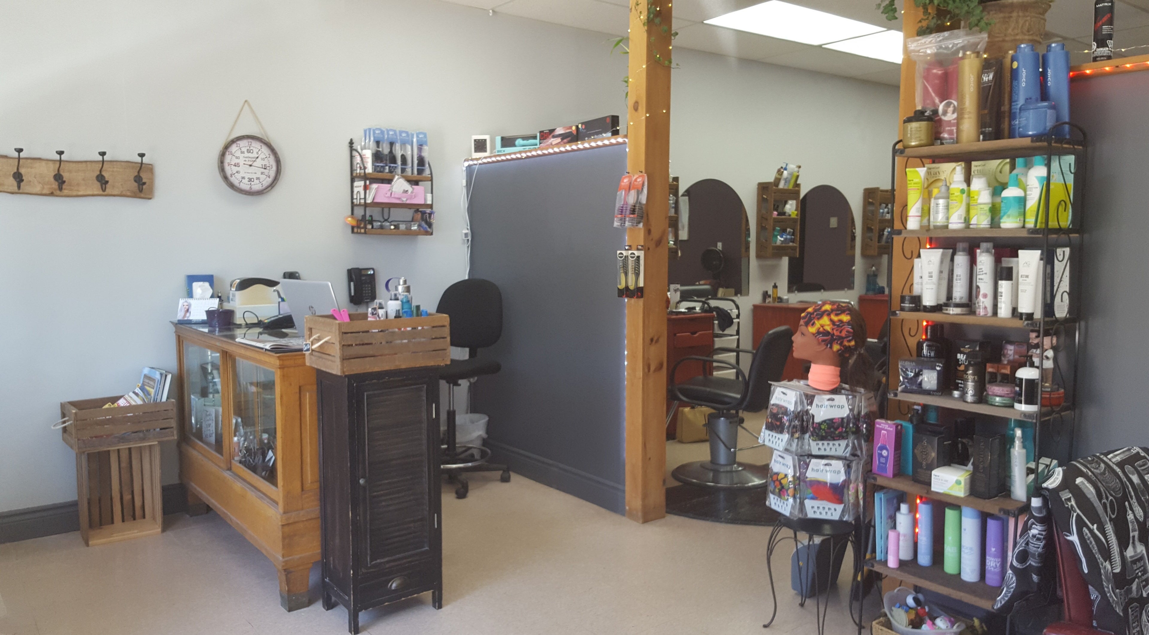 Cozy interior of Orillia Hair in Orillia, Ontario, CA, showcasing products and styling chairs.