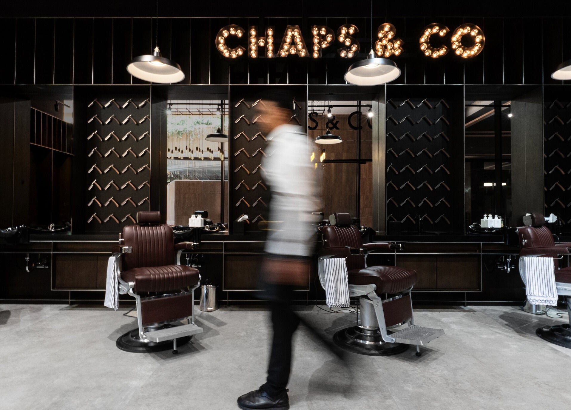 Modern barber chairs at Chaps & Co - VIA Riyadh in Riyadh, Riyadh Province, SA, exuding luxury and style.