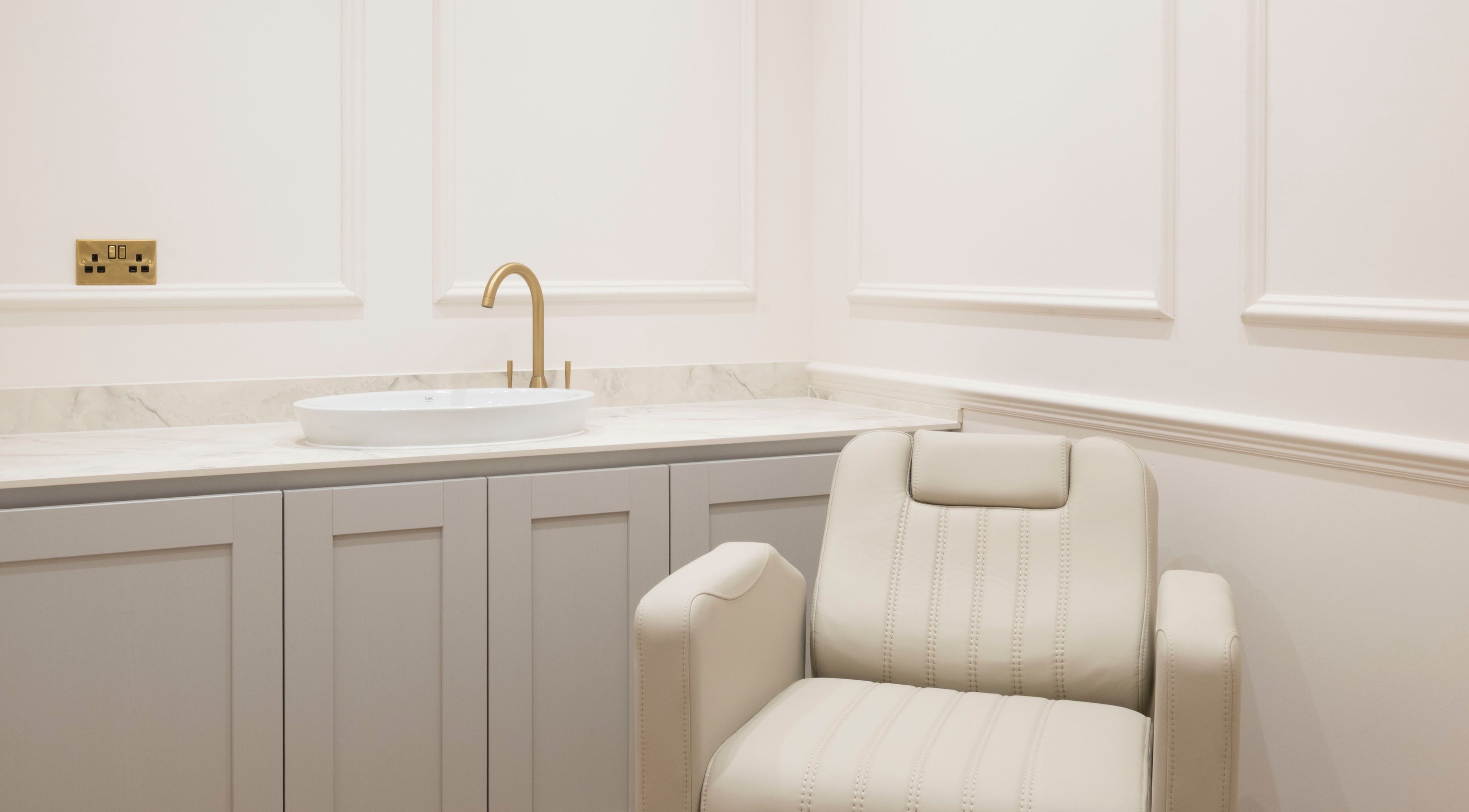 Luxurious chair and sink in Harlowes & Sophie Rae Medical, Sandwich, England for a tranquil spa experience.
