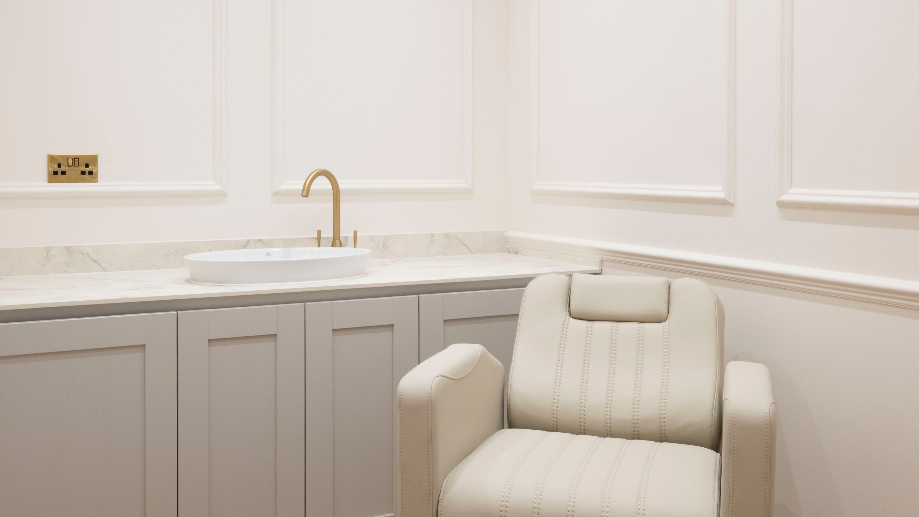 Luxurious chair and sink in Harlowes & Sophie Rae Medical, Sandwich, England for a tranquil spa experience.