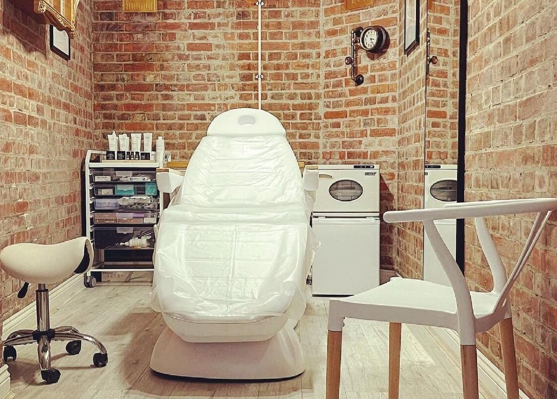 Cozy treatment room at Harlowes & Sophie Rae Medical, Sandwich, England, GB, featuring a modern white chair.
