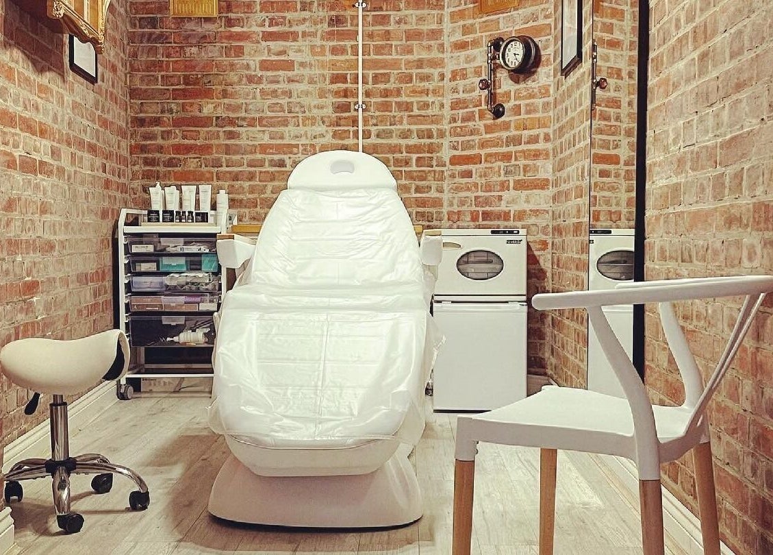 Cozy treatment room at Harlowes & Sophie Rae Medical, Sandwich, England, GB, featuring a modern white chair.