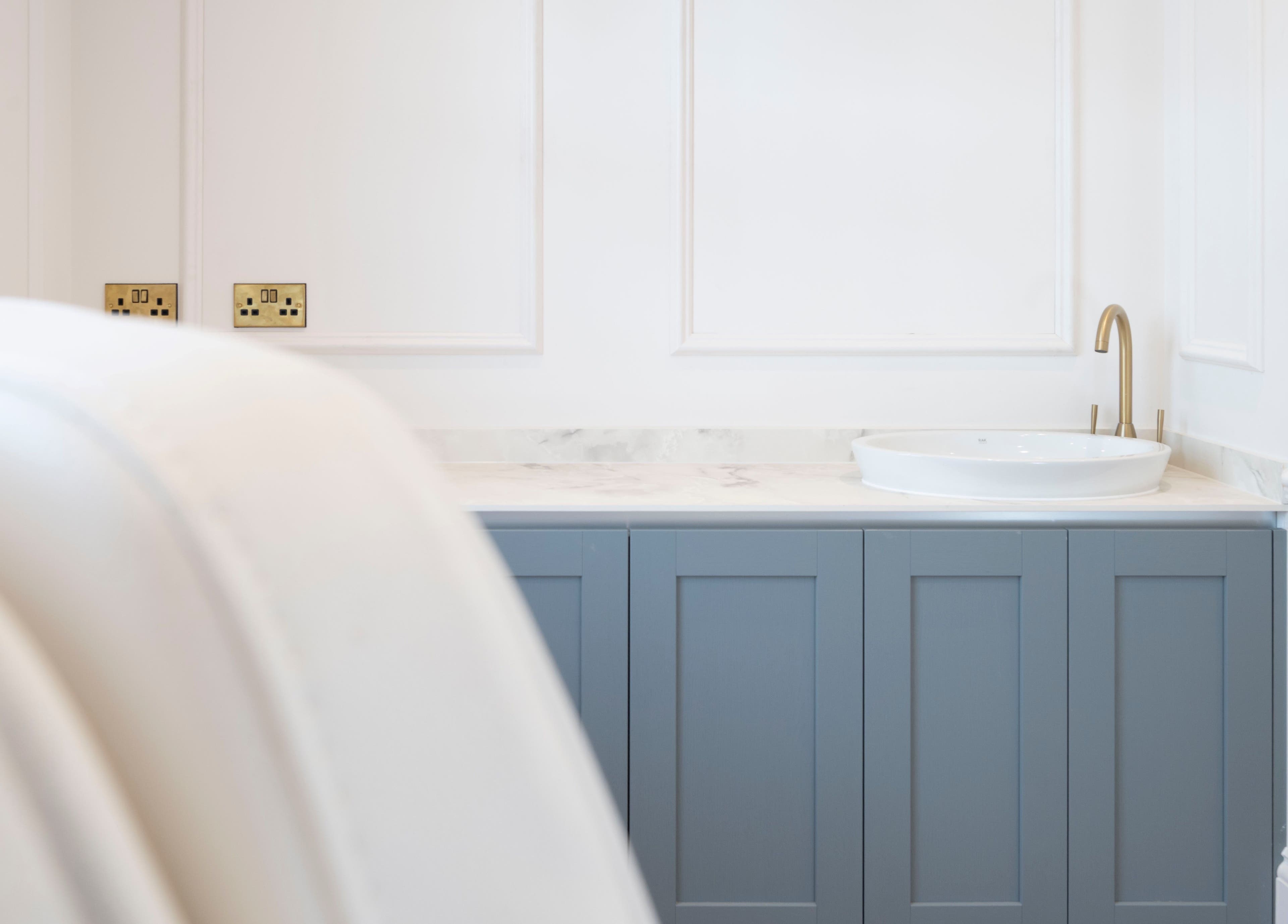 Sleek vanity area at Harlowes & Sophie Rae Medical, Sandwich, England, GB, with a chic basin and gold faucet.