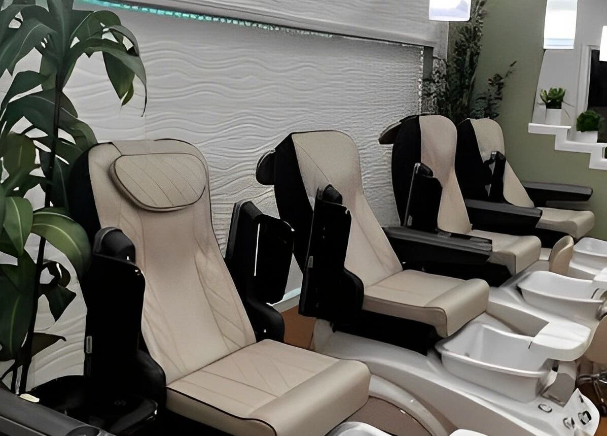 Luxurious pedicure chairs at Glamor Nails in Bound Brook, New Jersey, US, surrounded by lush greenery.
