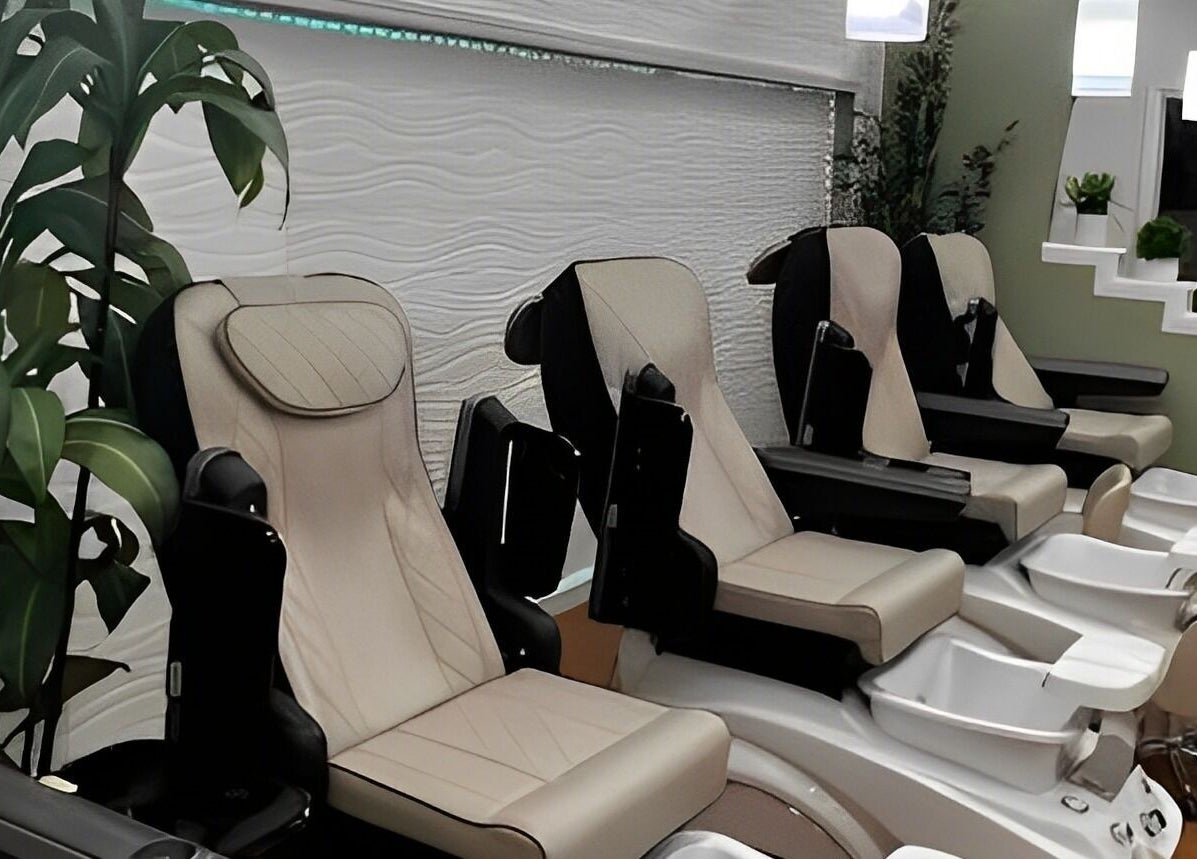 Luxurious pedicure chairs at Glamor Nails in Bound Brook, New Jersey, US, surrounded by lush greenery.