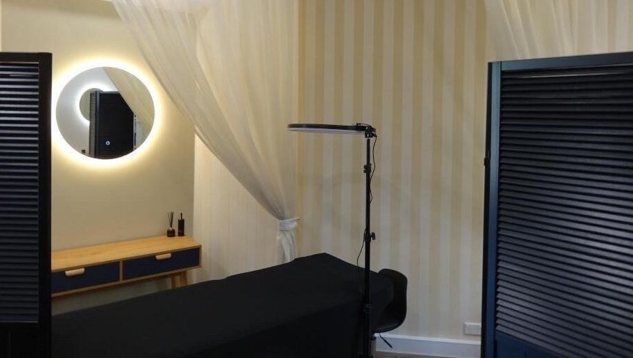 Elegant treatment room at Passion Lash and Brow, Mount Hawthorn, Western Australia, AU, featuring a stylish mirror.
