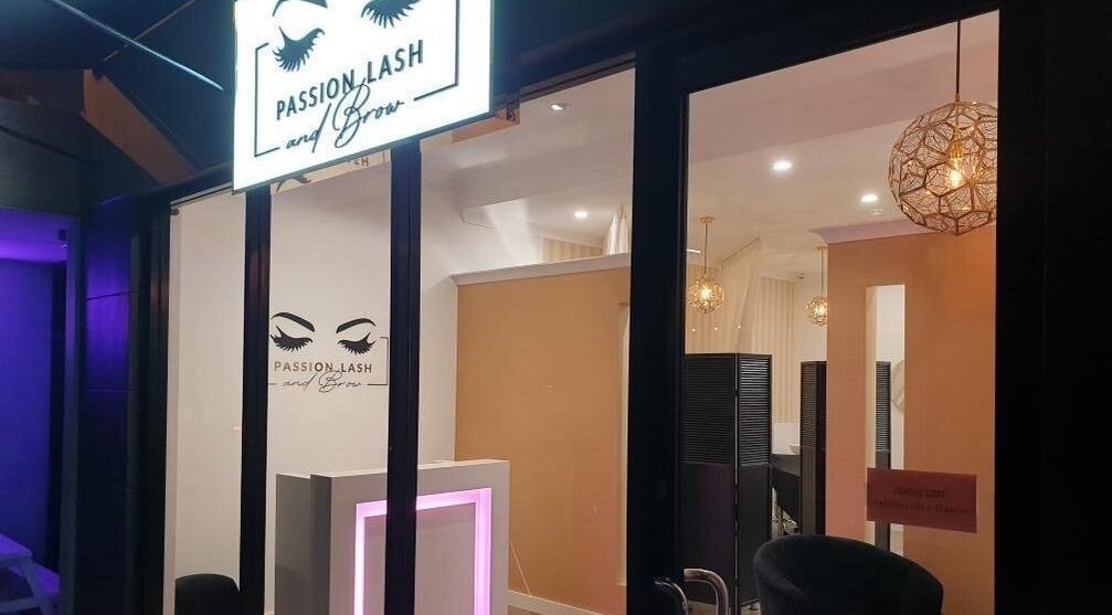 Illuminated entrance of Passion Lash and Brow in Mount Hawthorn, WA, AU, showcasing elegance and style.