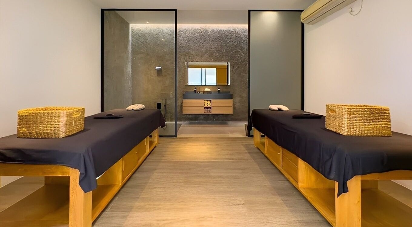 Tranquil massage room at Flow Beauty Lab, Bali, Bali, ID with dual tables and a soothing ambiance.