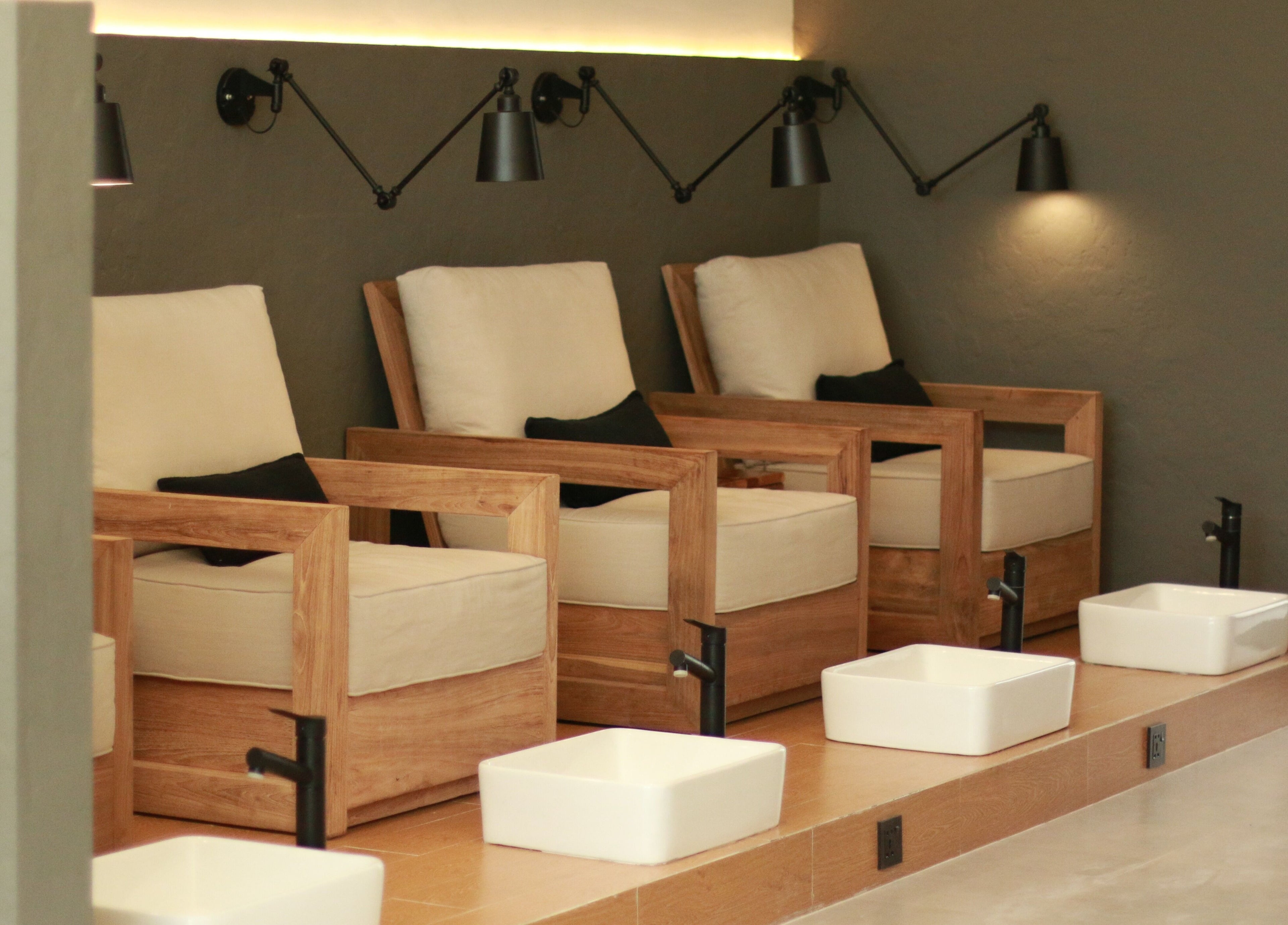 Inviting wooden spa chairs at Flow Beauty Lab, Bali, Bali, ID offering a serene relaxation experience.