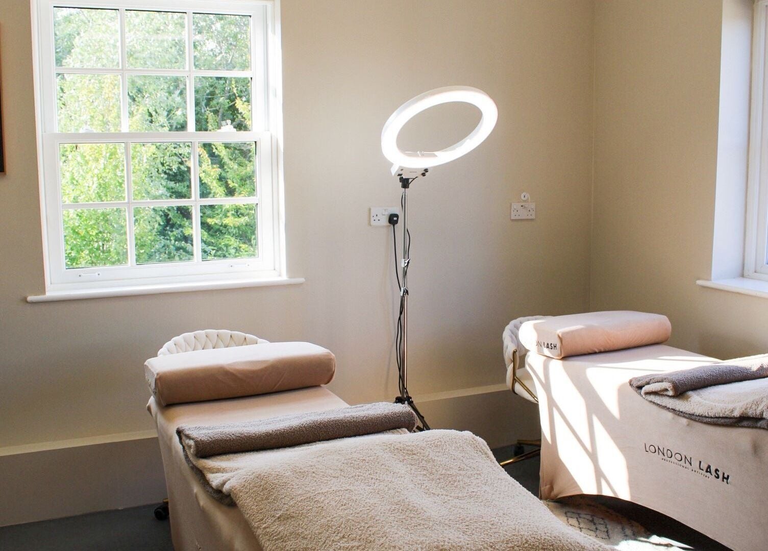 Cozy treatment room at True Lashes, House Of Beauty Framlingham, Framlingham, England, GB with two massage tables.