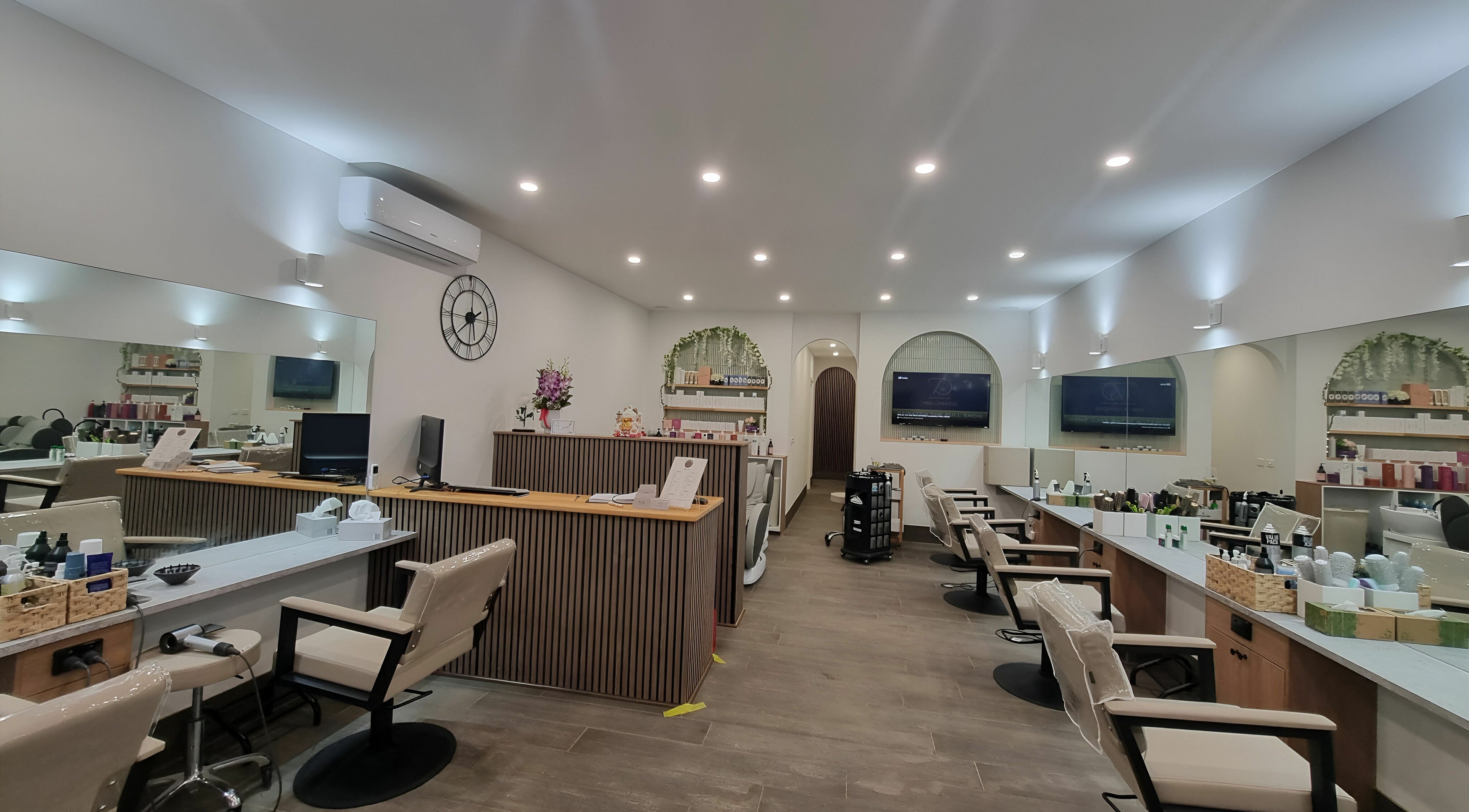 Modern and elegant interior of M3 Hair & Beauty in Melbourne, Victoria, AU, showcasing styling stations and decor.