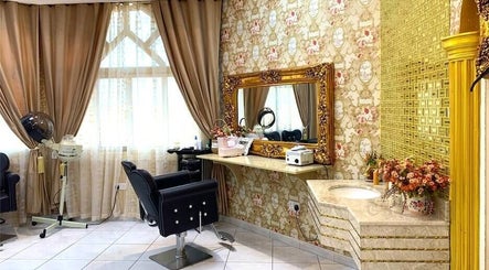 Luxurious beauty station at Damas Beauty Group - Al Mirgab in Sharjah, AE, featuring ornate decor and styling chair.