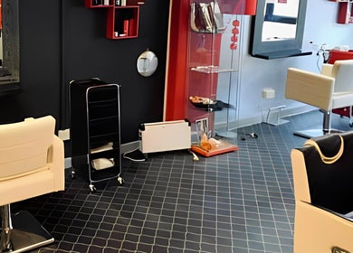 Stylish salon chairs and decor at Fuzion Hair & Beauty Zone, Stonehouse, England, GB.