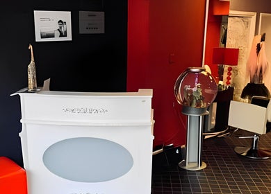 Modern interior of Fuzion Hair & Beauty Zone in Stonehouse, England, GB with stylish decor and seating.