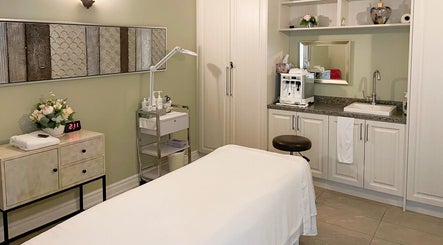 Relaxing treatment room at Fleuri Beauty and Spa, Markham, Ontario, CA with a massage table and calming decor.