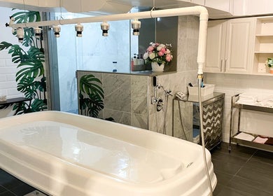 Luxurious spa room at Fleuri Beauty and Spa in Markham, Ontario, CA, featuring massage table and elegant decor.