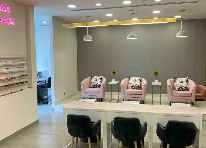 Stylish interior of Lush Nails, Dubai, Dubai, AE with elegant seating and nail polish display.