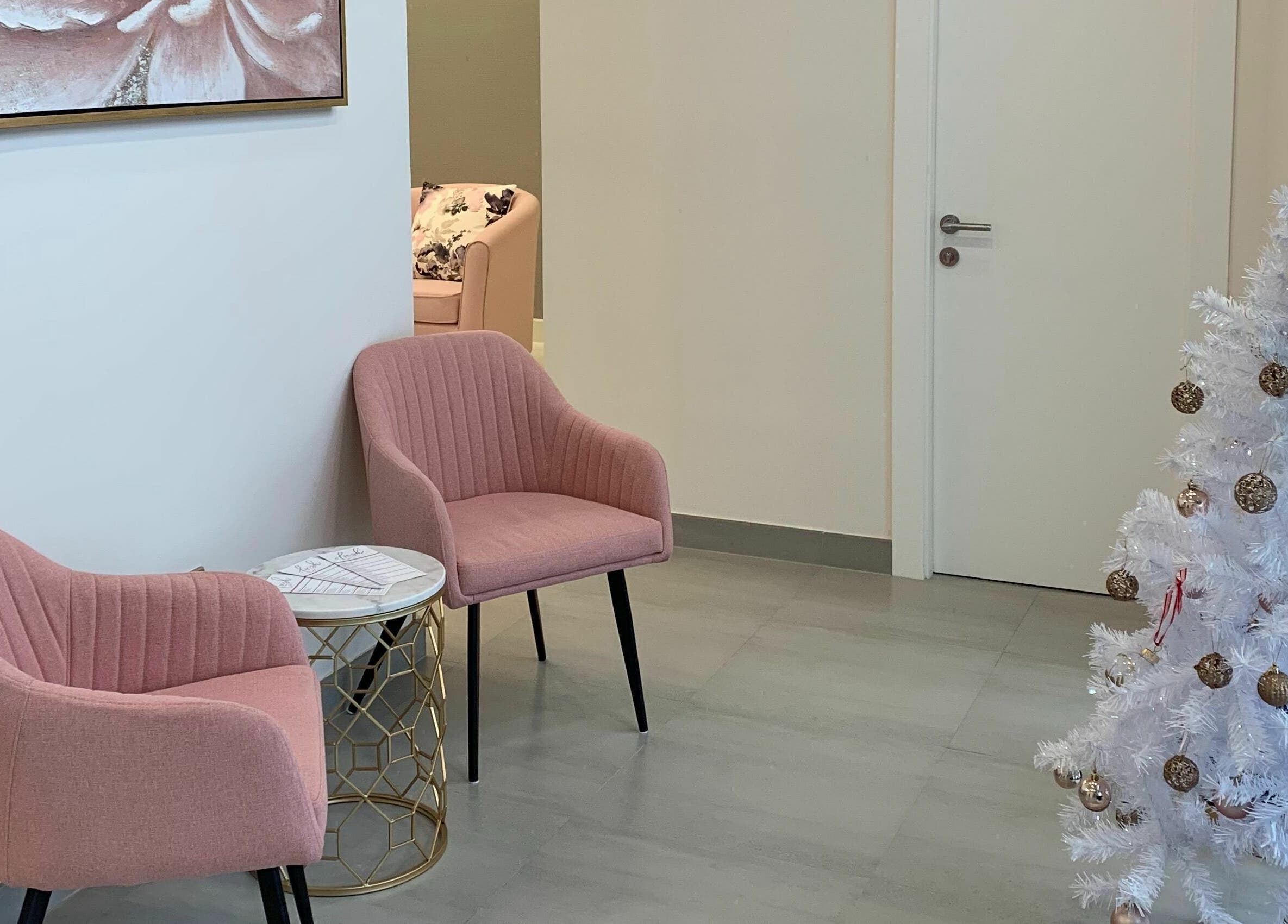 Chic seating area with pink chairs at Lush Nails, Dubai, Dubai, AE.