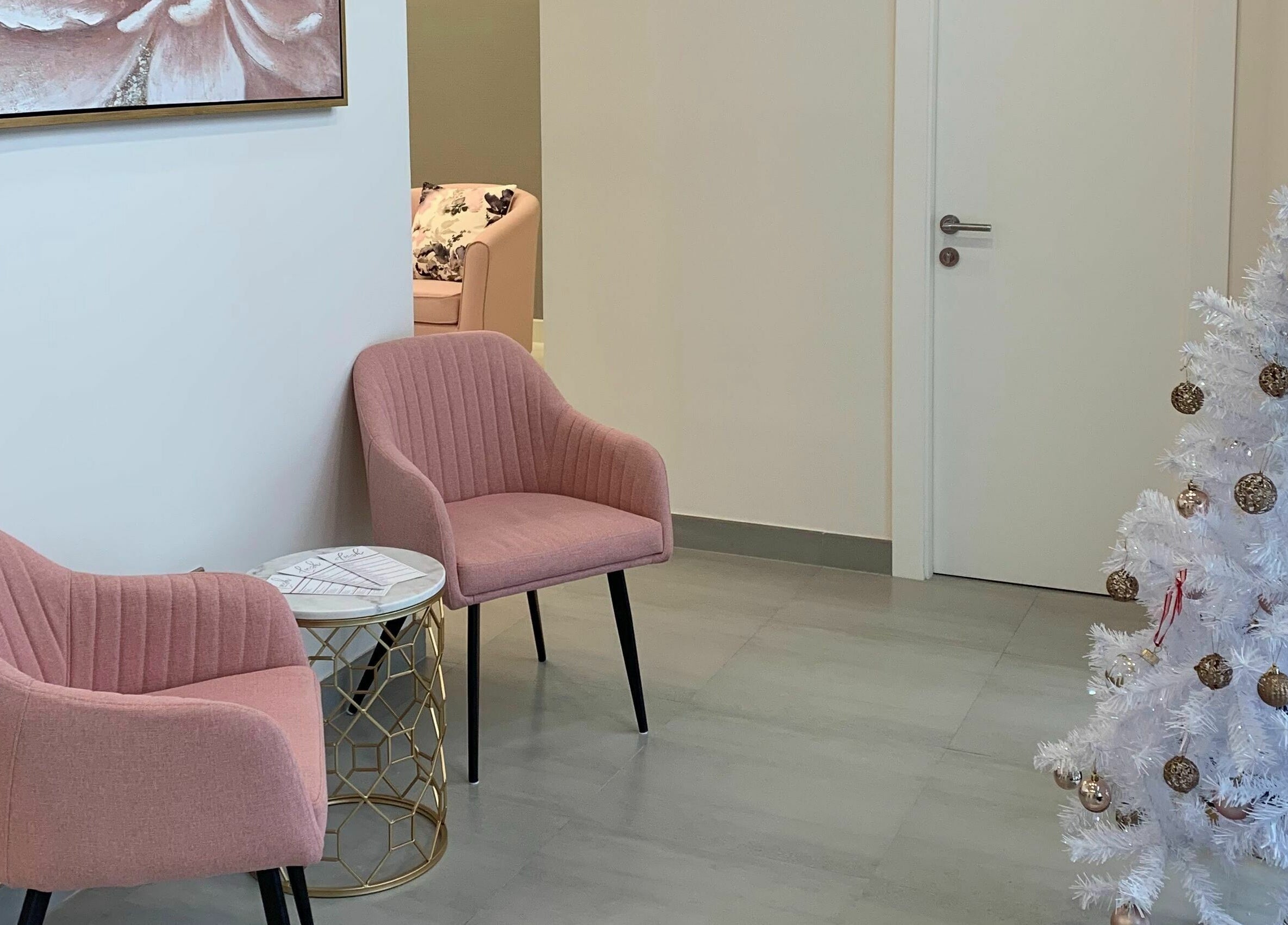 Chic seating area with pink chairs at Lush Nails, Dubai, Dubai, AE.