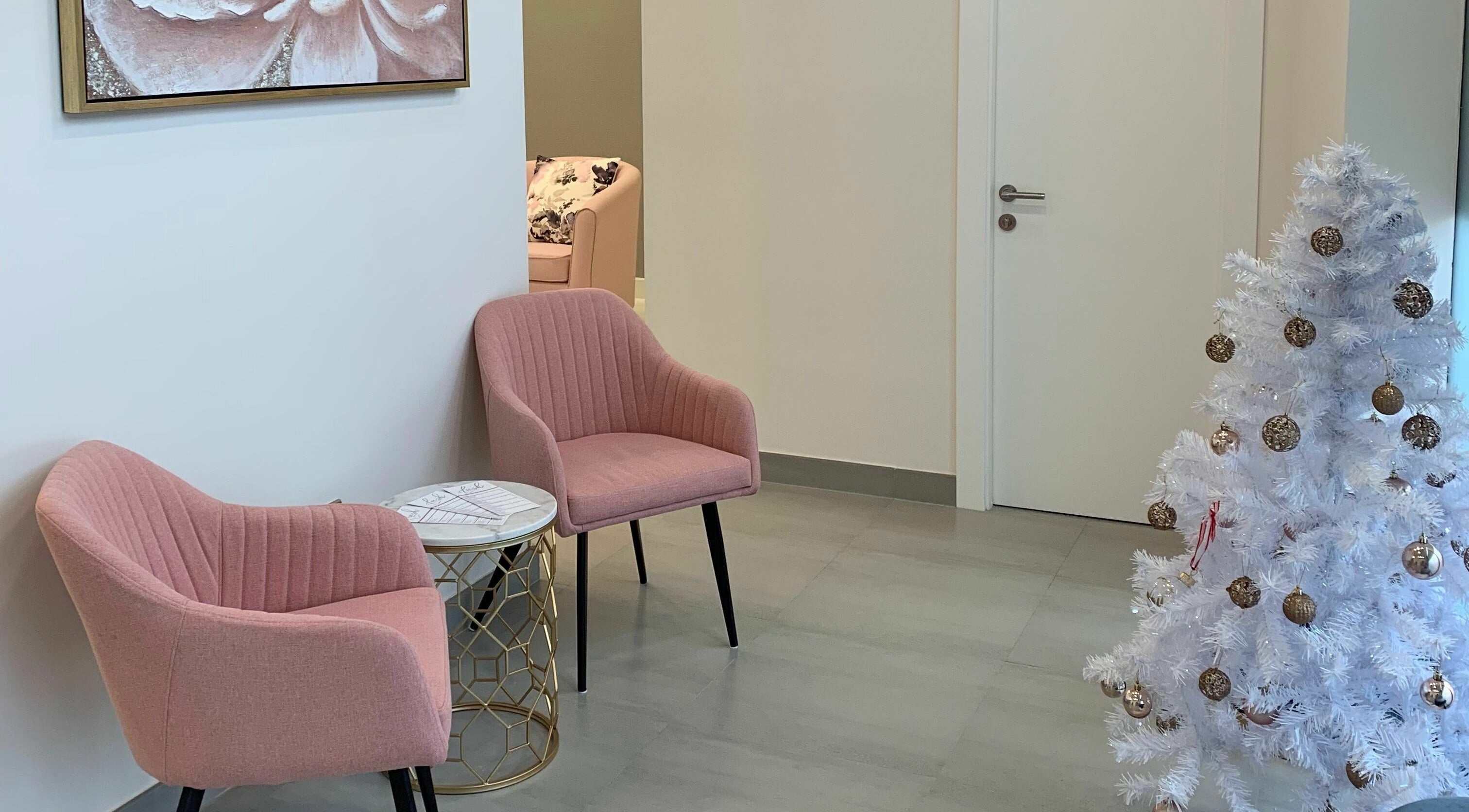 Chic seating area with pink chairs at Lush Nails, Dubai, Dubai, AE.