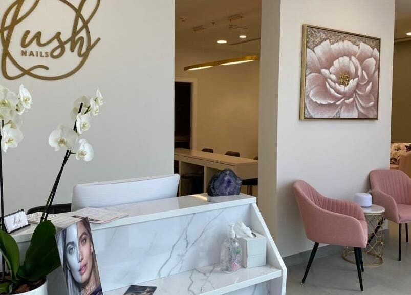 Reception area at Lush Nails, Dubai, Dubai, AE with chic decor and comfortable seating.
