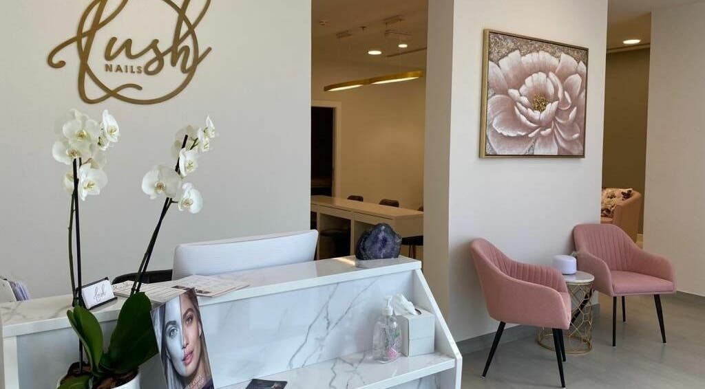 Reception area at Lush Nails, Dubai, Dubai, AE with chic decor and comfortable seating.
