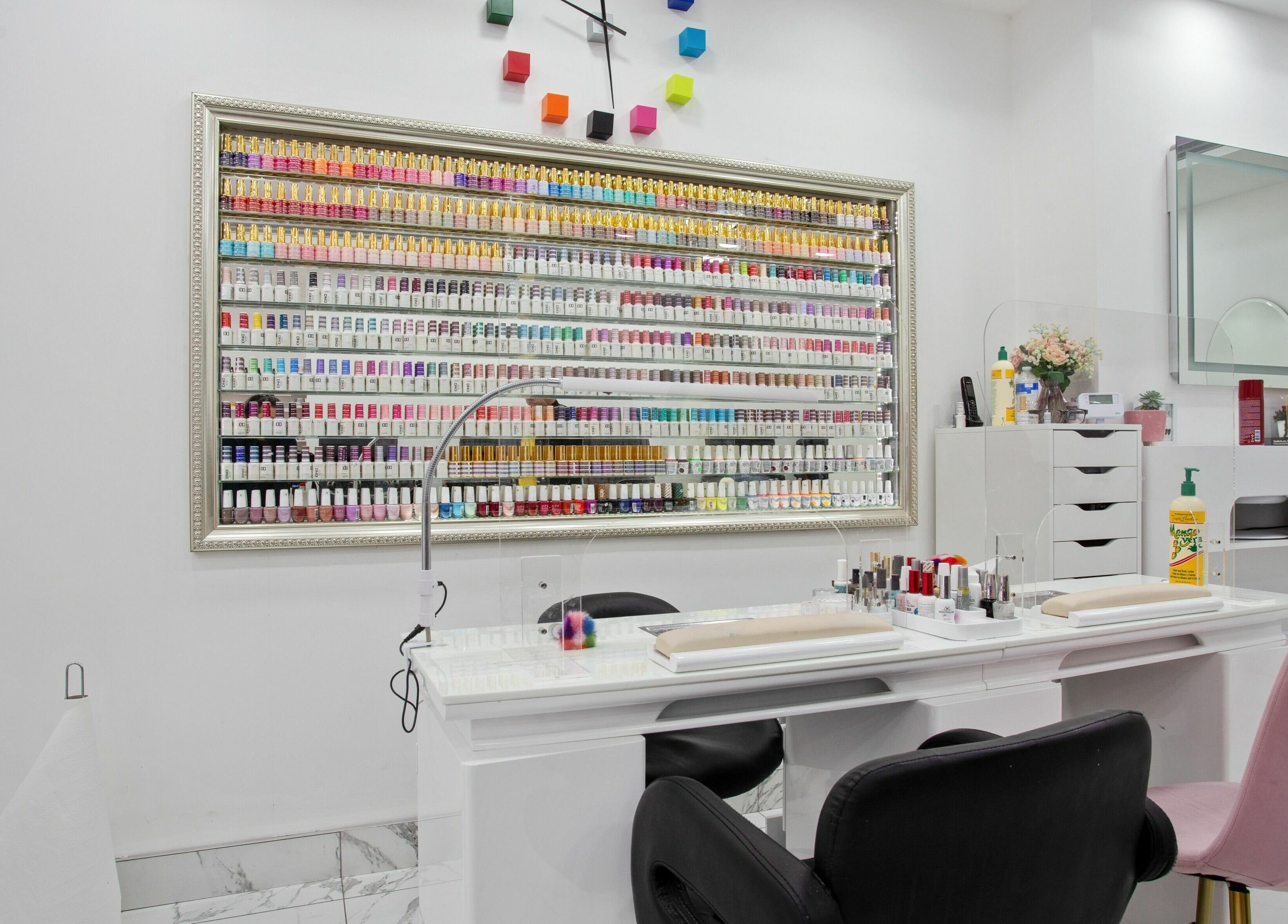 Haus of Colours nail polish display and manicure station in London, England, GB. Vibrant and luxurious setup.