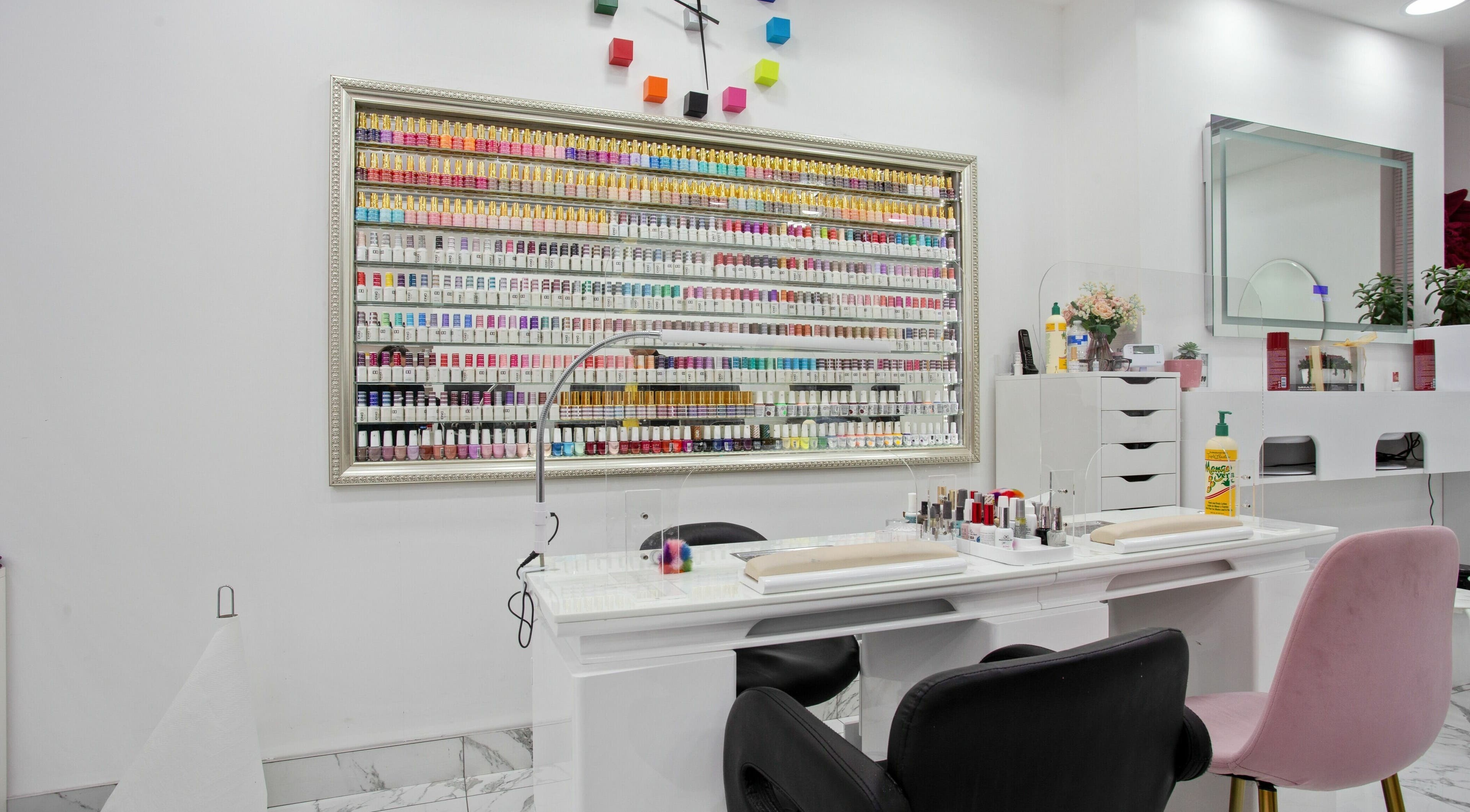 Haus of Colours nail polish display and manicure station in London, England, GB. Vibrant and luxurious setup.