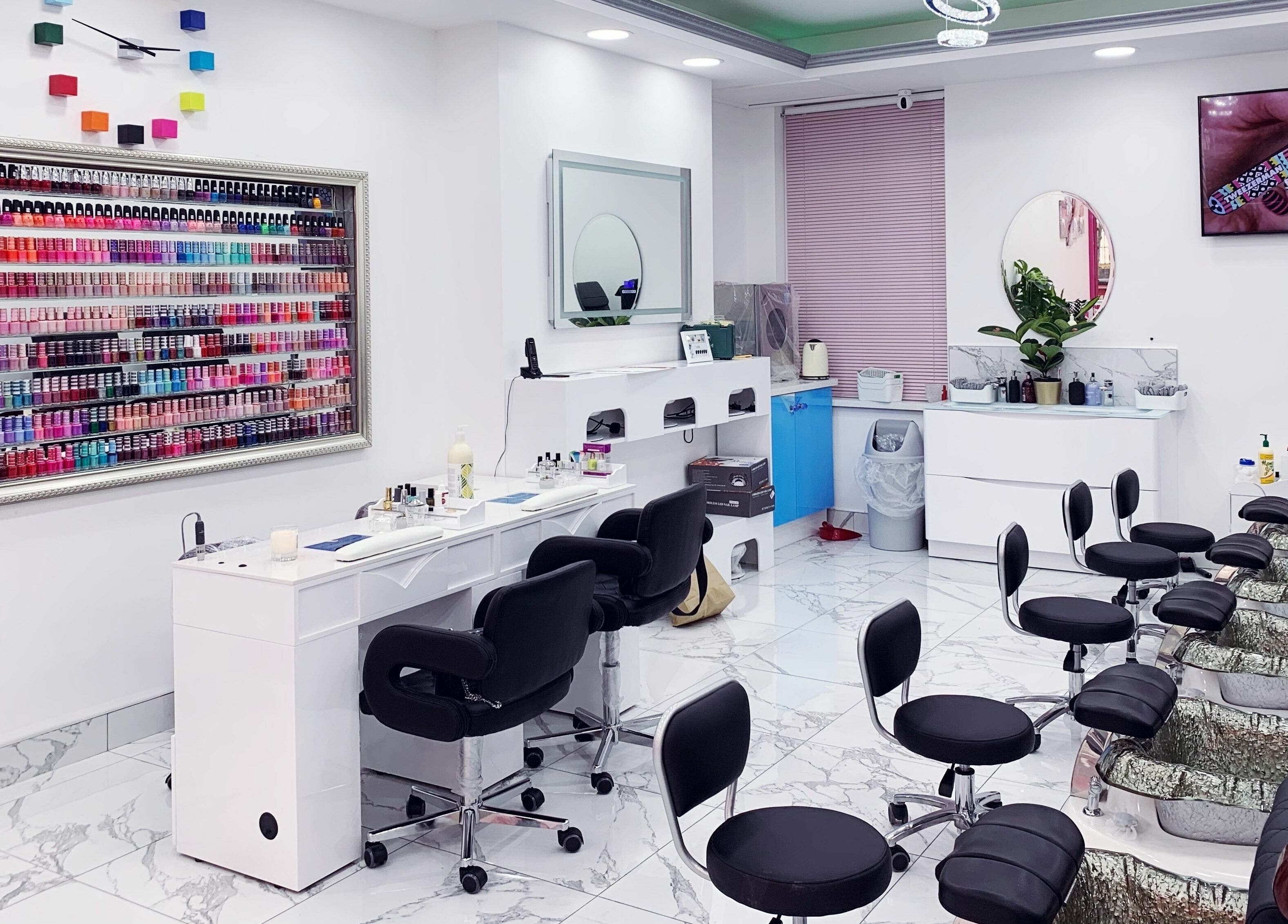 Vibrant nail polish display and seating at Haus of Colours, London, England, GB.
