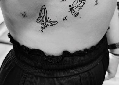 Butterfly tattoo design at The Lash Bar, Holland-on-sea, England, GB, highlighting unique body art.