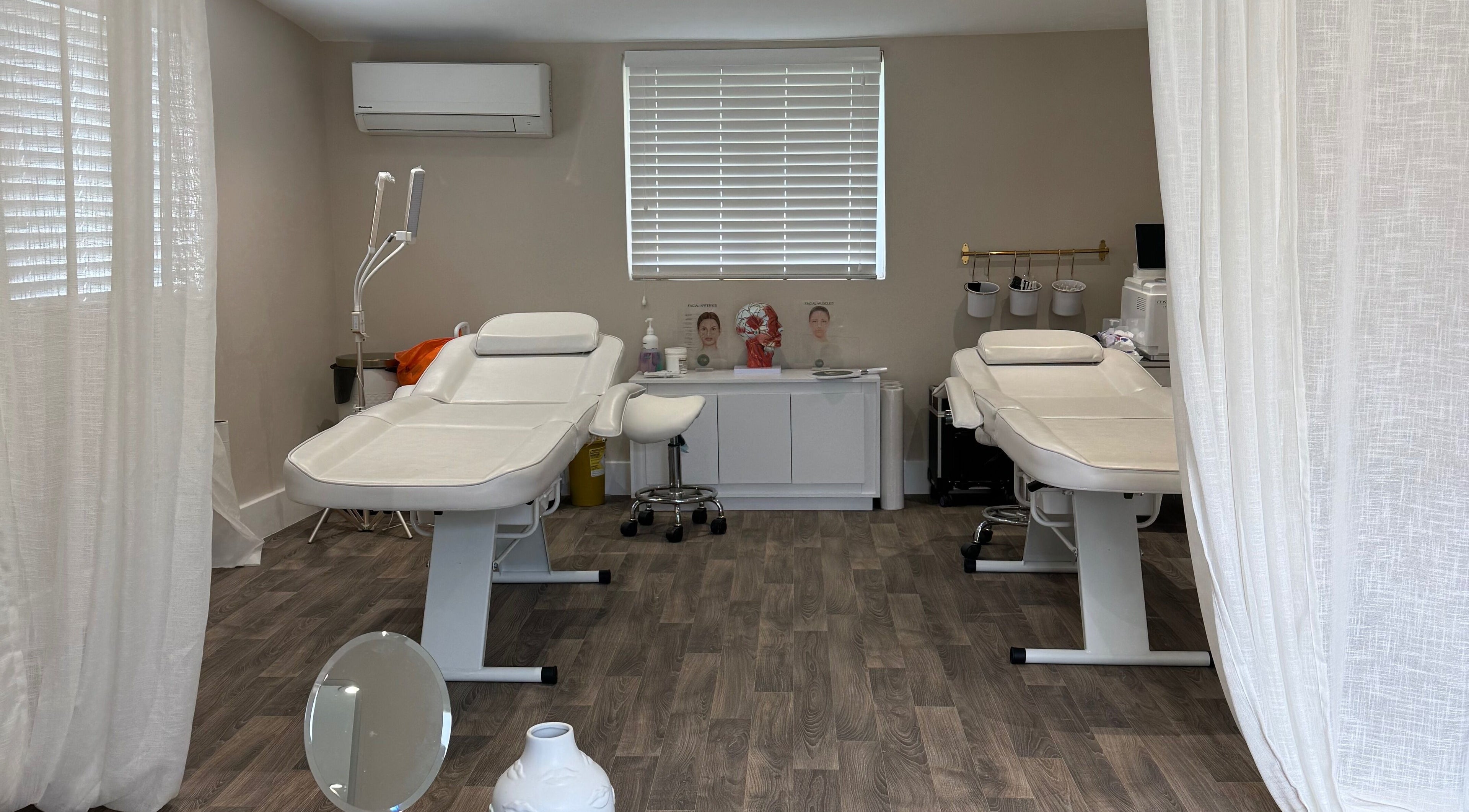 Calm treatment room at Faux Beauty - Treatments & Training Oxted in Oxted, England, GB featuring serene beds.