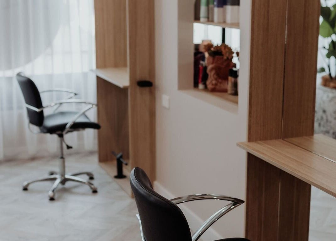 Modern salon interior at Soul Hair @ McGraths Hill in Mcgraths Hill, New South Wales, AU, featuring sleek chairs.