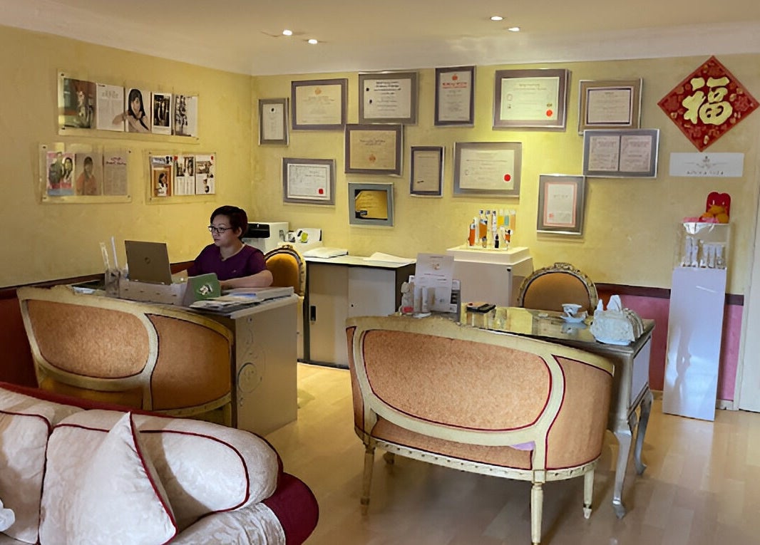 Reception area at Emma Lizs Subang Jaya, featuring elegant decor and framed certificates. Subang Jaya, Selangor, MY.