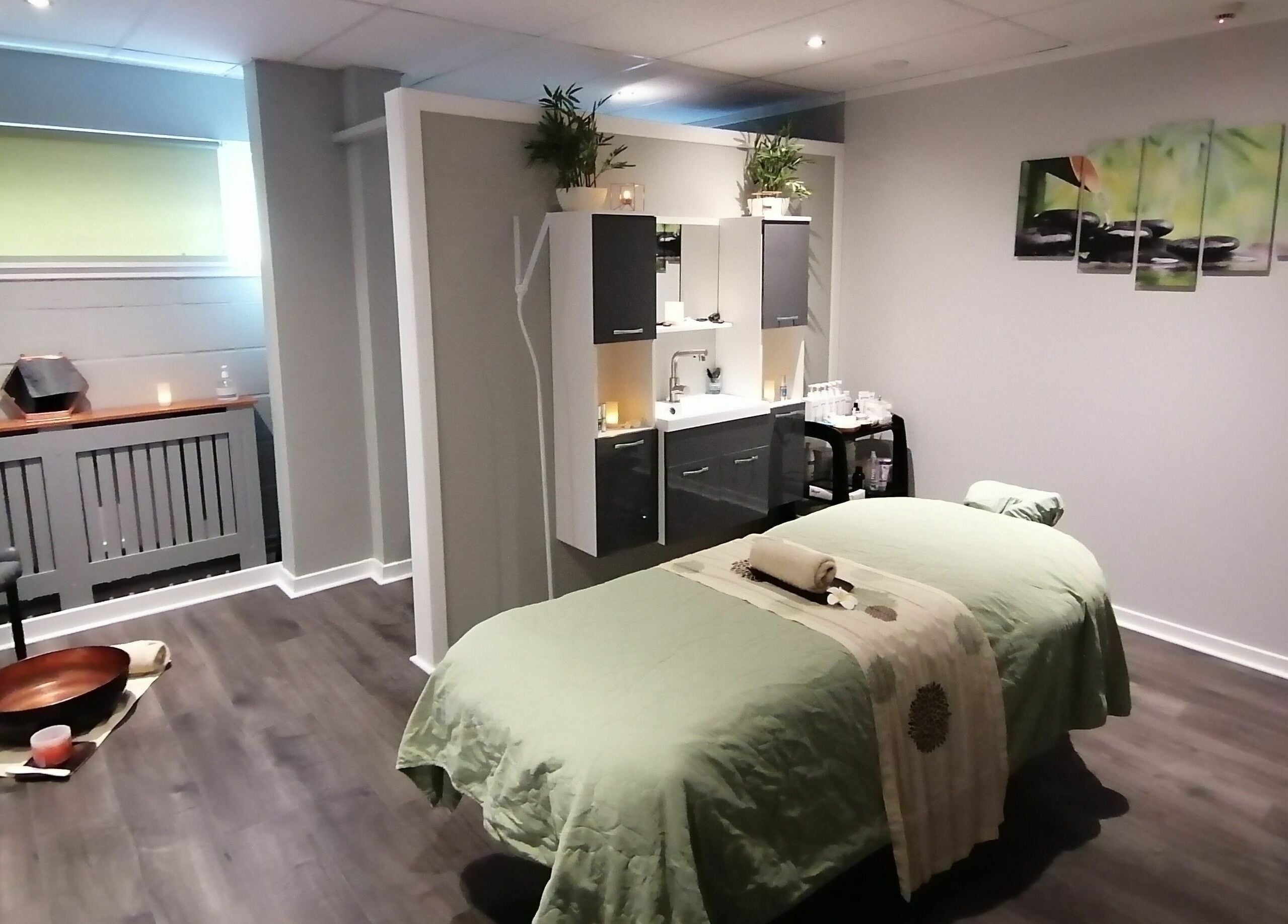 Peaceful treatment room at Skin Unique ltd, Dalgety Bay, Scotland, GB with a massage table and ambient lighting.