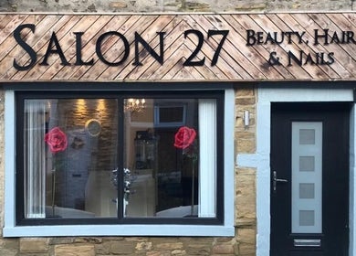 Salon27 entrance showcasing stylish design in Barrowford, England, GB, with vibrant rose decor.