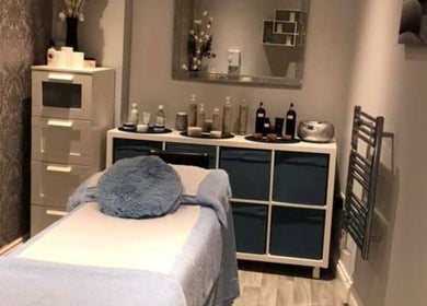 Cozy treatment room at Salon27, Barrowford, England, GB, with massage bed and serene decor.